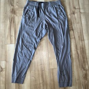 Light grey Nike lightweight joggers Size medium. Worn in good condition